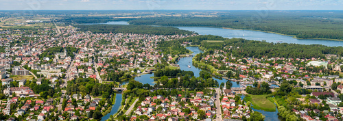 Augustow city by Netta river and Necko lake aerial landscape under blue sky © lukszczepanski