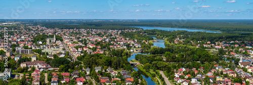 Augustow city by Netta river and Necko lake aerial landscape under blue sky