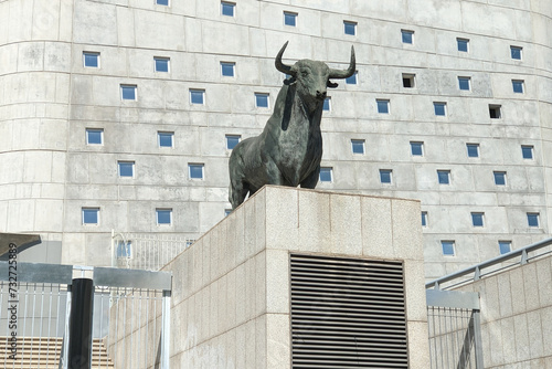 Statue of a bull on the facade of the building of bullring. The bull is an iconic symbol of Spain photo