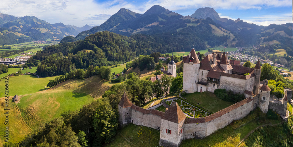 Switzerland travel and landmarks. scenic medieval village and castle Gruyere. canton Fribourg. Aerial drone video.