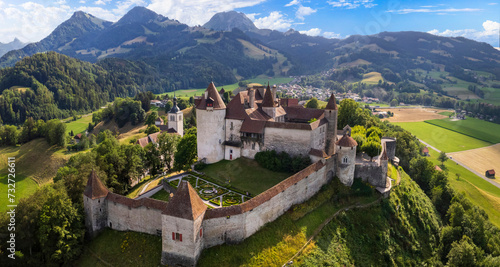 Switzerland travel and landmarks. scenic medieval village and castle Gruyere. canton Fribourg. Aerial drone video. photo