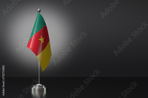 Small National Flag of the Republic of Cameroon on a Black Background. 3d Rendering