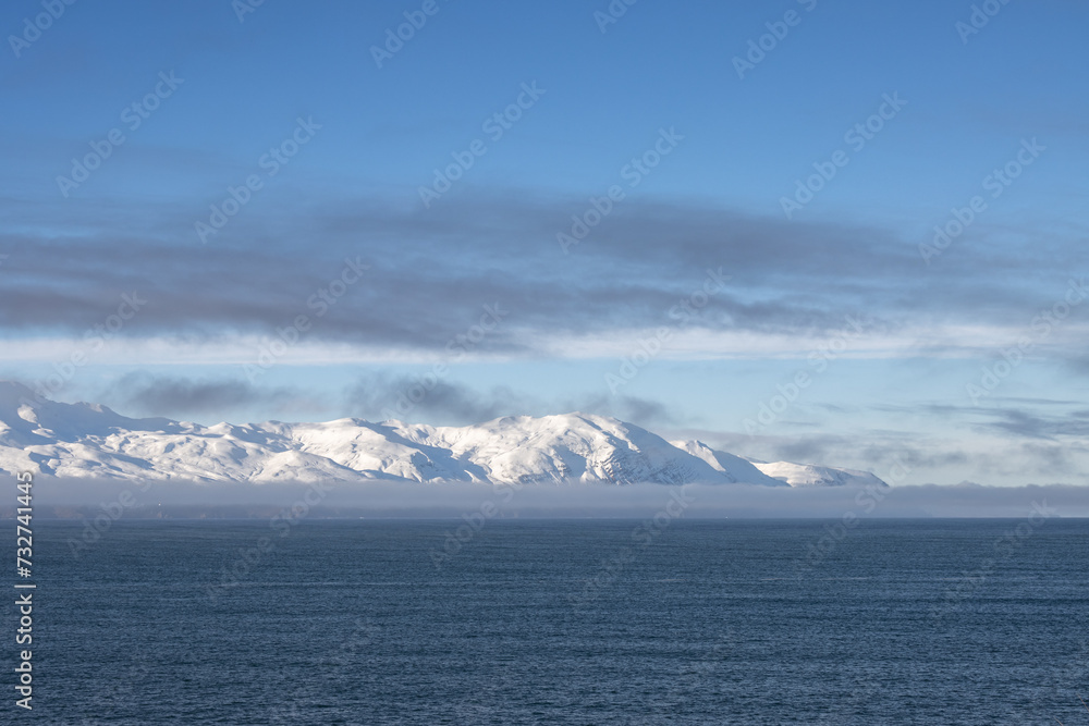 Atlantic ocean and snowy mountains, North Iceland