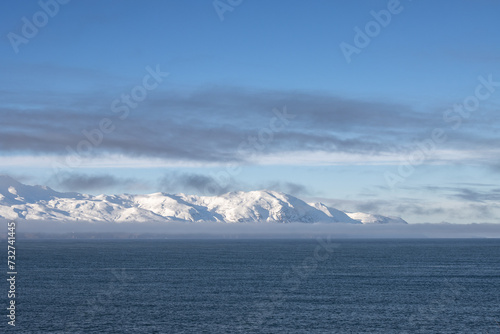 Atlantic ocean and snowy mountains, North Iceland © yassmin