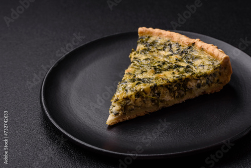 Delicious crispy quiche cut into slices with cheese, broccoli, tomatoes