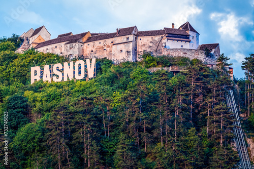 Rasnov citadel and city sign view on the hill, Romania