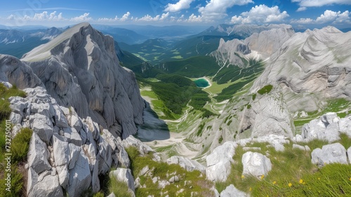 Wide panorama of rugged mountains and a deep valley view