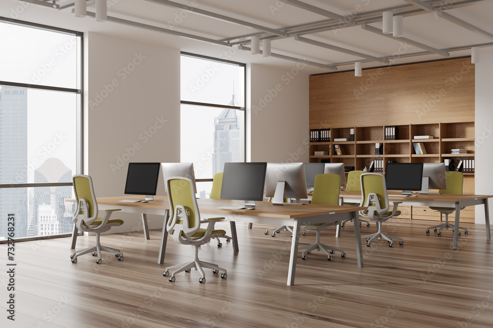 Modern coworking interior with desk and shelf, workspace near panoramic window Modern coworking interior with desk and shelf, workspace near panoramic window