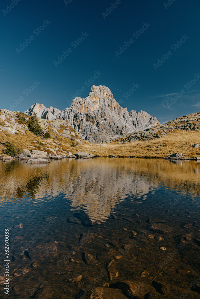 Beautiful reflection in a hidden mountain lake in the Alps