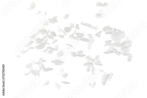 Fresh coconut flakes on white background, top view. Close-up photo