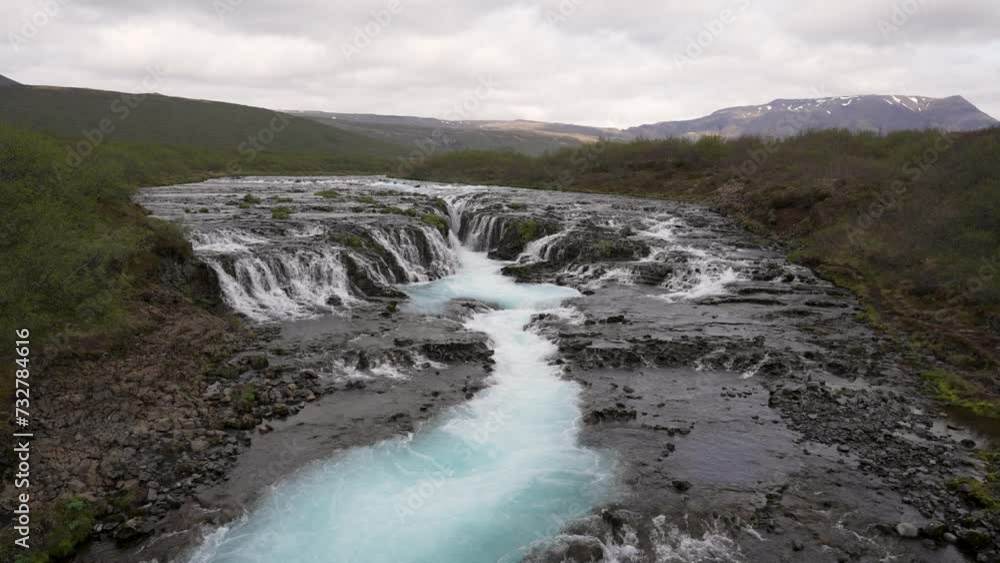 The hidden Brúarfoss waterfall and its beauty of blue waters located in the golden circle.
The hidden Brúarfoss waterfall and its beauty of blue waters located in the golden circle.