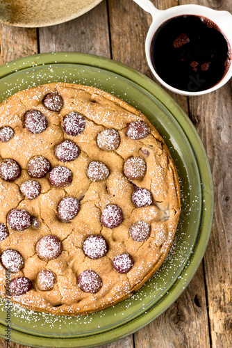 Grape Cake dusted with powdered sugar, grape syrup on green plate quick lunch photo