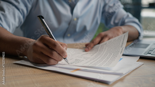 Close up male hands writing exam in class business paperwork with glass of water on office desk unrecognizable man businessman student studying write paper notes document text form insurance summary