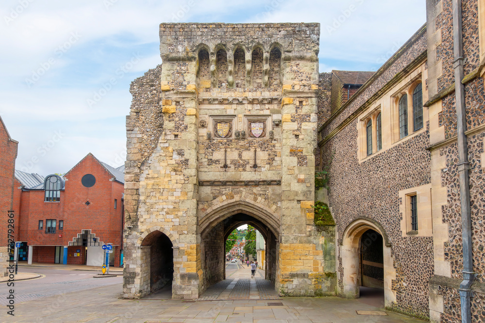 The Tudor West Gate into the historic medieval city of Winchester, with the main High Street in the distance in Winchester, England, United Kingdom.