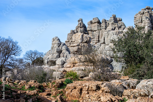 Hiking the Torcal de Antequerra National Park, limestone rock formations and known for unusual karst landforms in Andalusia, Malaga, Spain.