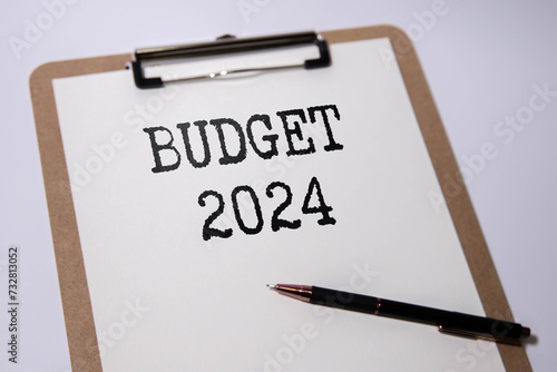 2024 Budget planning and allocation concept. magnifying glass on a notepad.