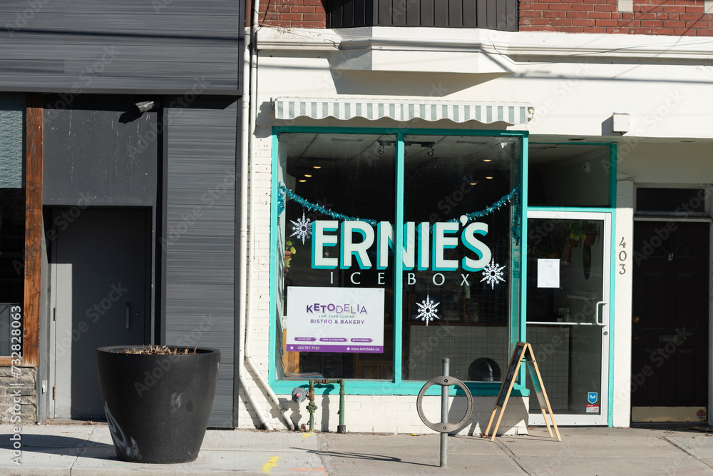 exterior building facade display window and sign of Ernie's Icebox, an