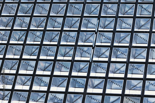 rows of windows, reflection on modern city building, interesting pattern in daily life, blue, white and black repeatative pattern