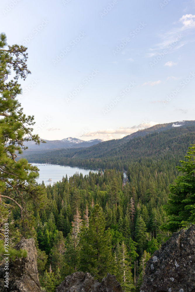 lake with forest and mountains during sunset lake with forest and mountains during sunset