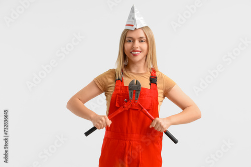Female worker with tool on ...