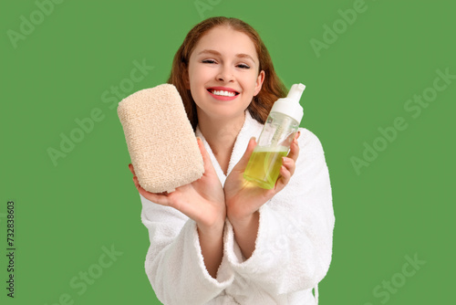 Young woman in bathrobe wit...