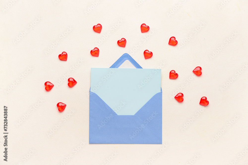 Envelope with blank card and hearts on light background. Valentine's Day celebration Envelope with blank card and hearts on light background. Valentine's Day celebration