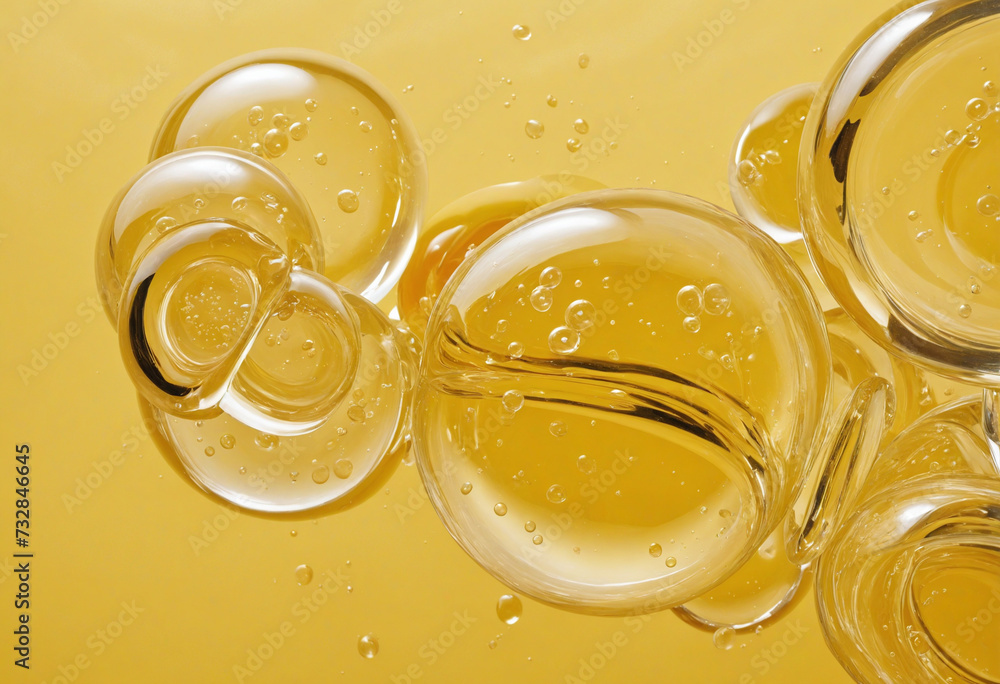 Golden yellow bubble oil or serum isolated on yellow background