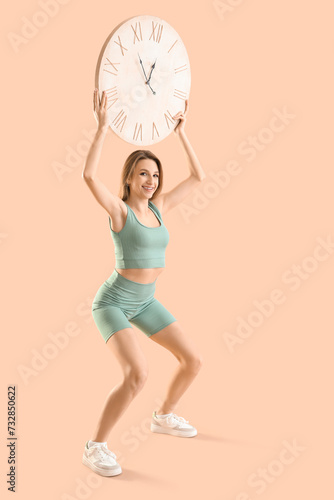Sporty young woman with big...