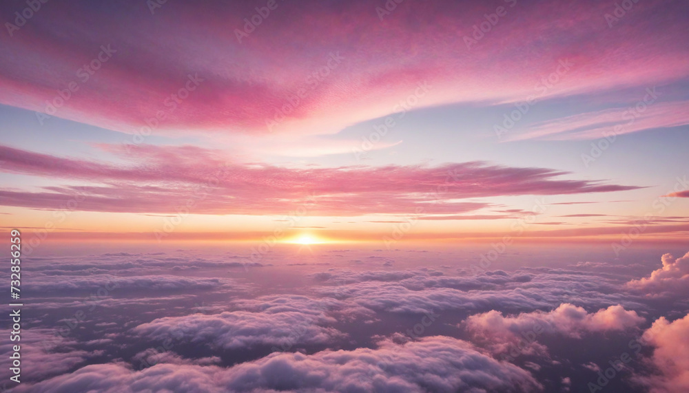 Aerial perspective of the pink sky and sun peeking through clouds Aerial perspective of the pink sky and sun peeking through clouds