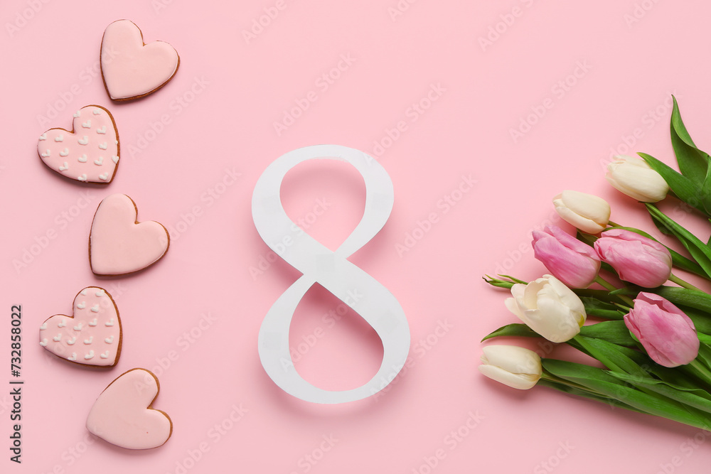 Fototapeta premium Figure 8 made of paper with tulip flowers and cookies on pink background. International Women's Day celebration