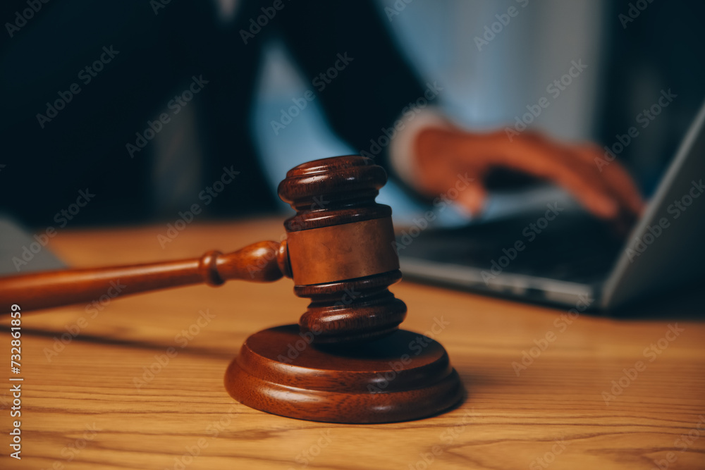 Judge gavel with Justice lawyers having team meeting at law firm background. Concepts of Law and Legal services. Judge gavel with Justice lawyers having team meeting at law firm background. Concepts of Law and Legal services.