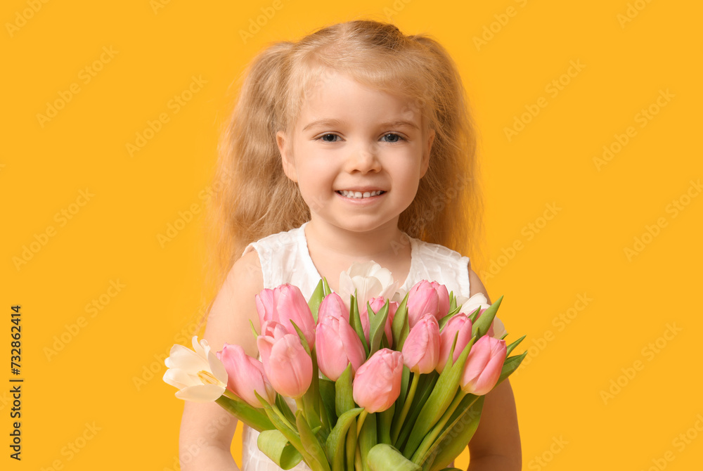 Cute little girl with bouquet of beautiful tulips on yellow background. International Women's Day Cute little girl with bouquet of beautiful tulips on yellow background. International Women's Day