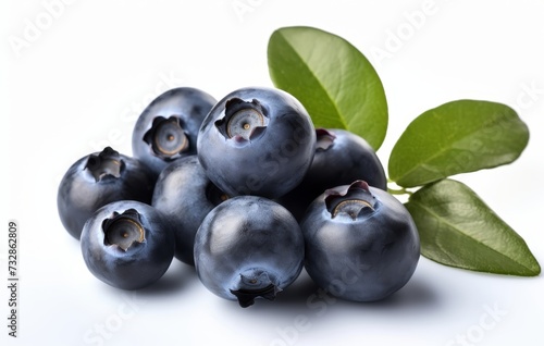 Blueberries with green leaves on white background. Full sharpness for each blueberry.