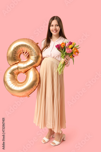 Smiling pregnant woman hold...