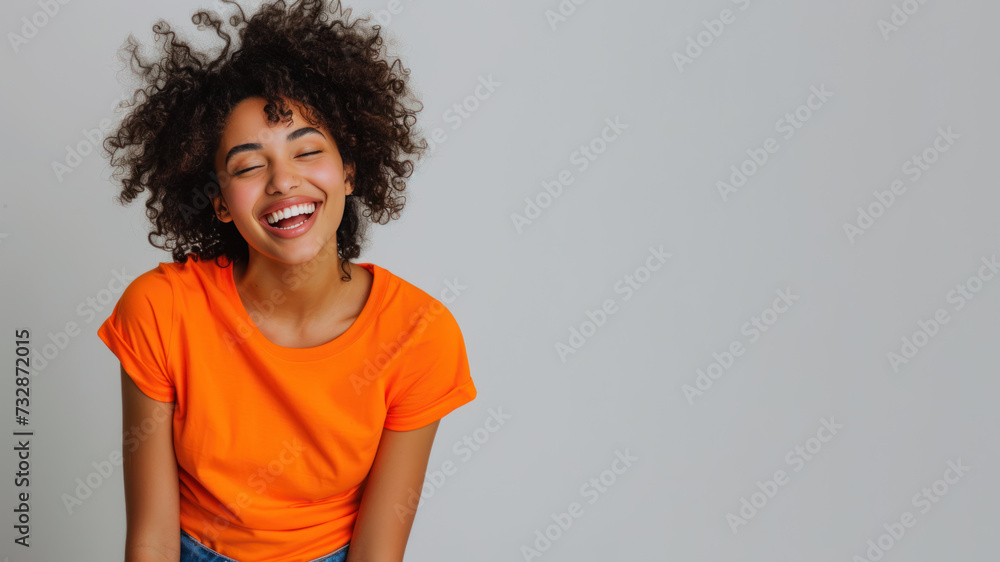 Afro woman wear orange casual t-shirt smile isolated Afro woman wear orange casual t-shirt smile isolated