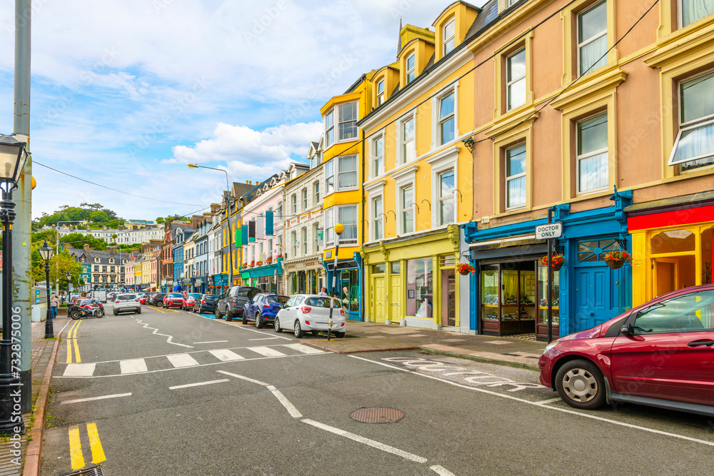 The main street of cafes, pubs and shops along the seaside promenade at Cobh, County Cork, Ireland.