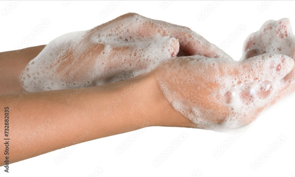 Fototapeta premium cropped view of female hands in soap foam isolated on beige