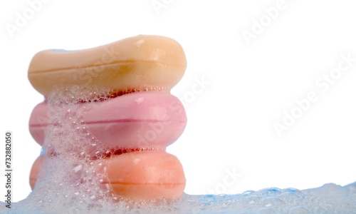 cropped view of female hands in soap foam isolated on beige