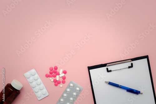 Flat lay of a bottle of med...