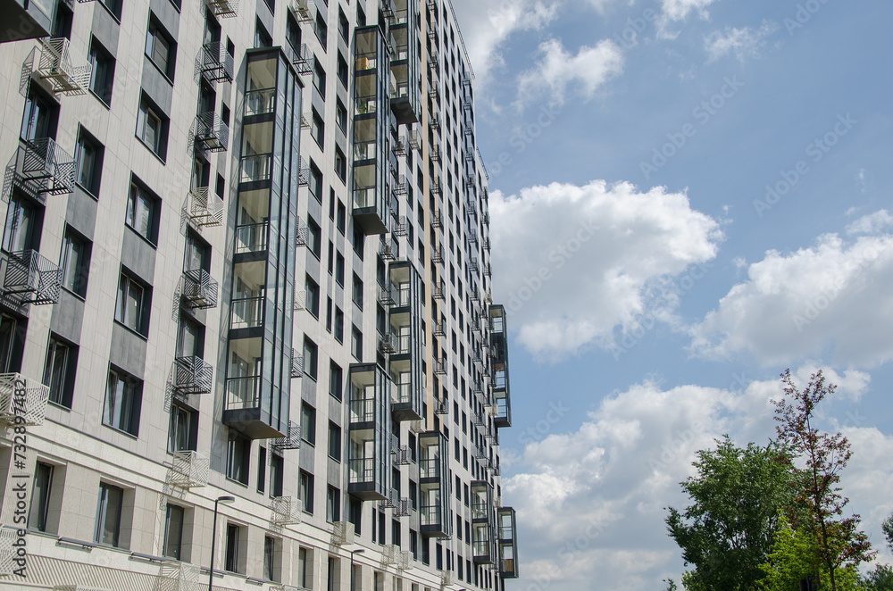 Fototapeta premium City high-rise buildings against the blue sky. Office apartments.