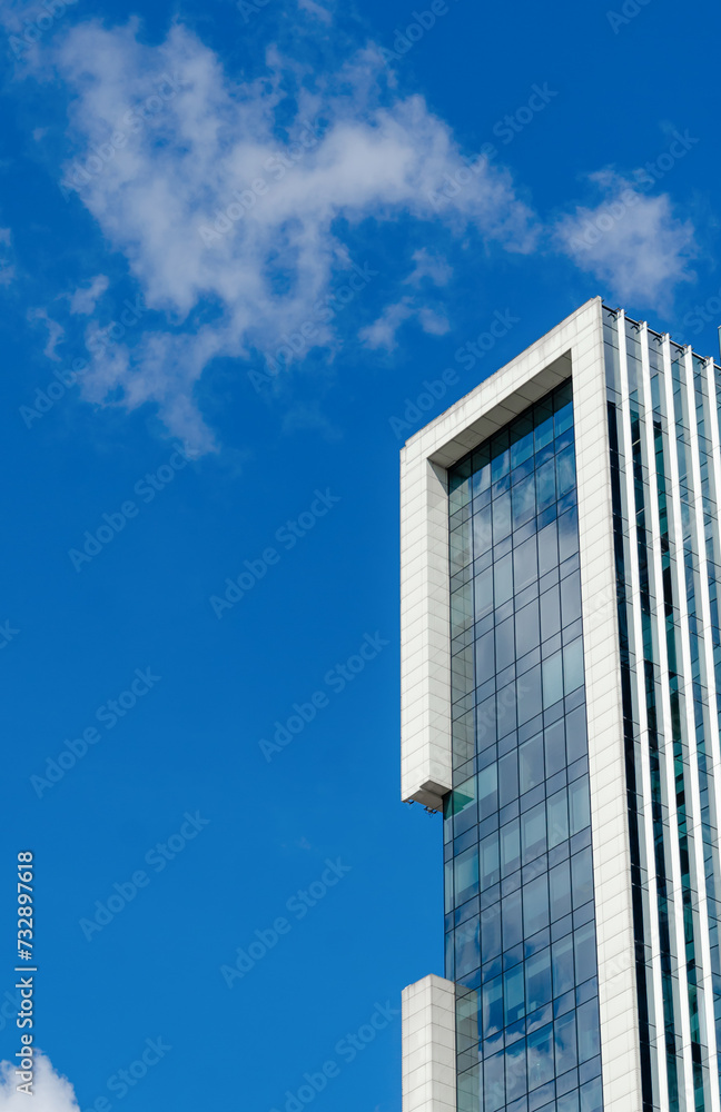 City high-rise buildings against the blue sky. Office apartments. City high-rise buildings against the blue sky. Office apartments.
