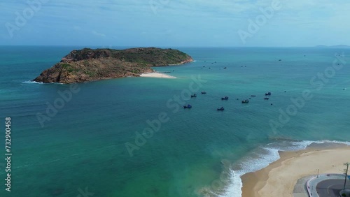 Aerial landscape at Hon Kho beach, Binh Dinh, Vietnam with islands and fishermen's fishing boats in the daylight. Concept of marine nature and travel.