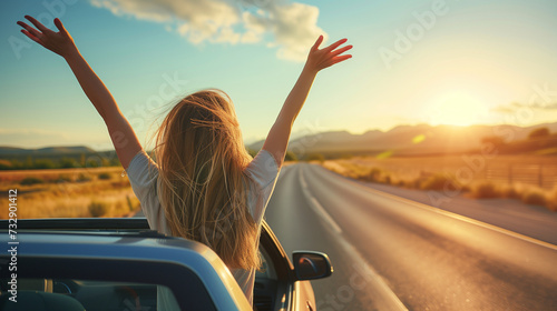 Young attractive brunette woman sitting with her hands up in cabriolet summer, road trip concept