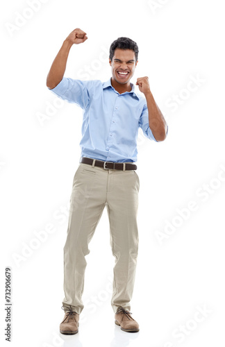 Success, fist and business man in studio for celebration, achievement or winning with bonus or happy sales. Excited employee or winner with yes for news, goals or opportunity on a white background