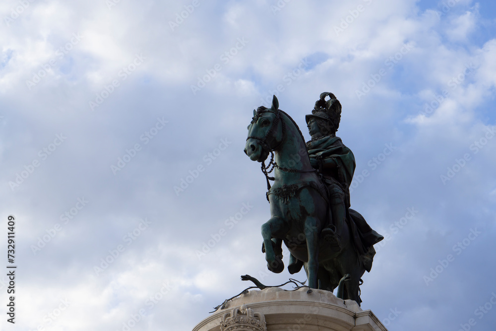Fototapeta premium 20.03.2022 Lisbon, Portugal. View of the Praça do Comércio. Lisbon monuments. Rua Augusta Arch and statue of King jose I. next to the Praça do Comércio (Commerce square) in Lisbon, Portugal.