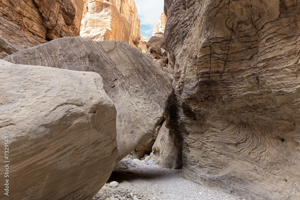 Huge boulders on tourist route of gorge Wadi Al Ghuwayr or An Nakhil and wadi Al Dathneh near Amman in Jordan