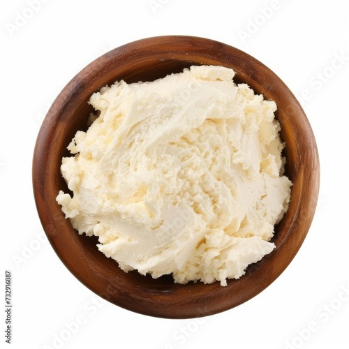 Top view of a bowl of cream cheese isolated on white background