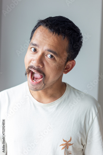 Portrait of angry moustache artist asian man emotion facial face