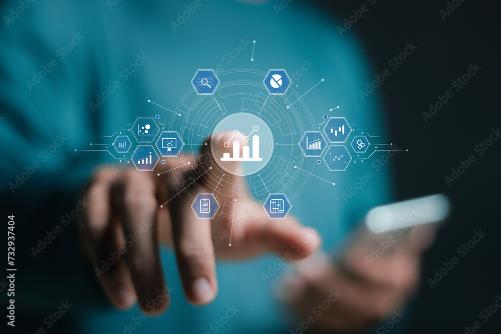 Big data analytics and business intelligence concept. Businessman touch virtual chart and graph icons. Big data analytics and business intelligence concept. Businessman touch virtual chart and graph icons.