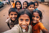 A group of rural smiling Indian kids make a selfie outside, childish spontaneity